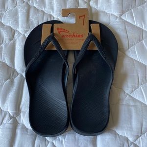 Archies black flip flops